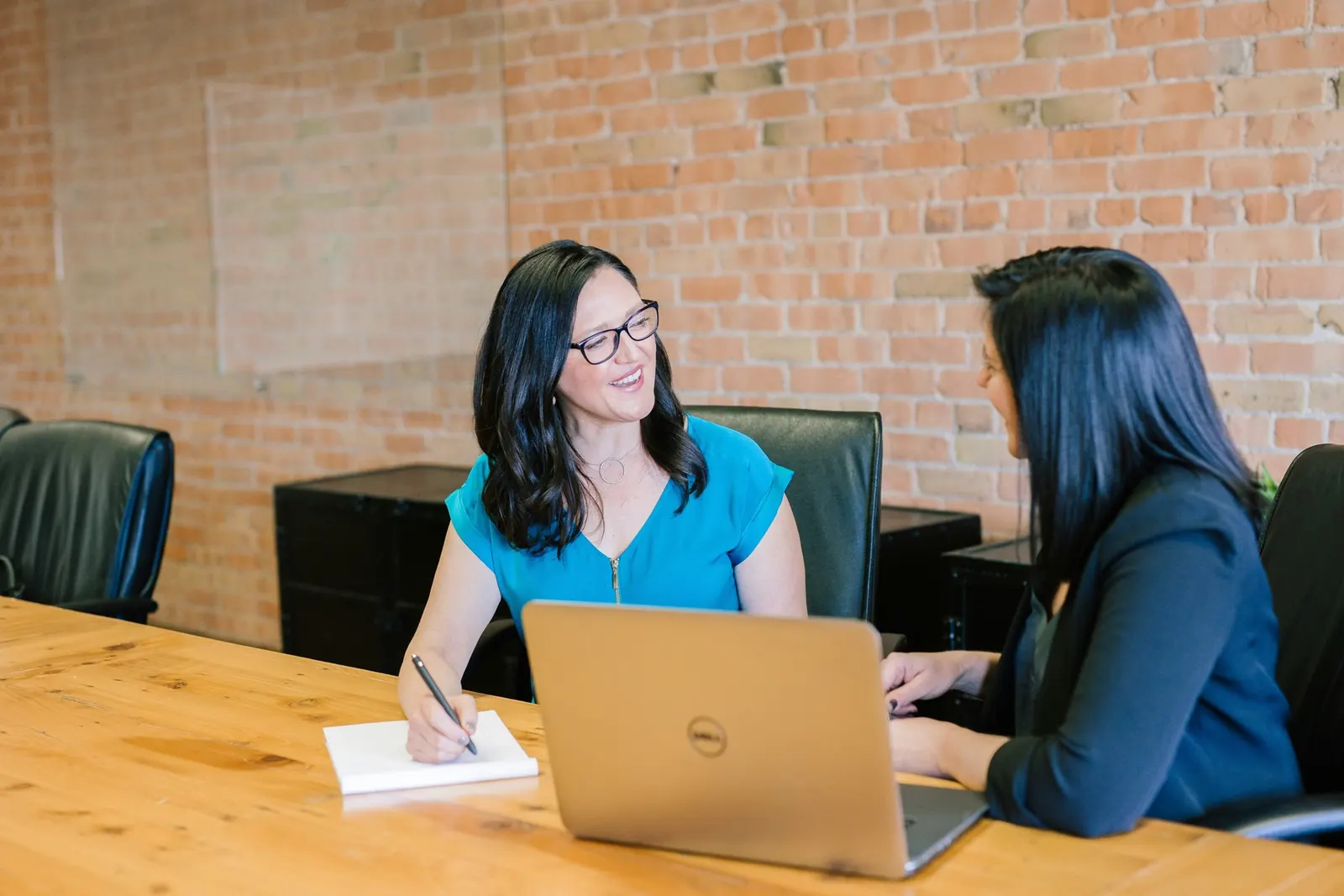 Financial advisor reviewing wealth plans with a client